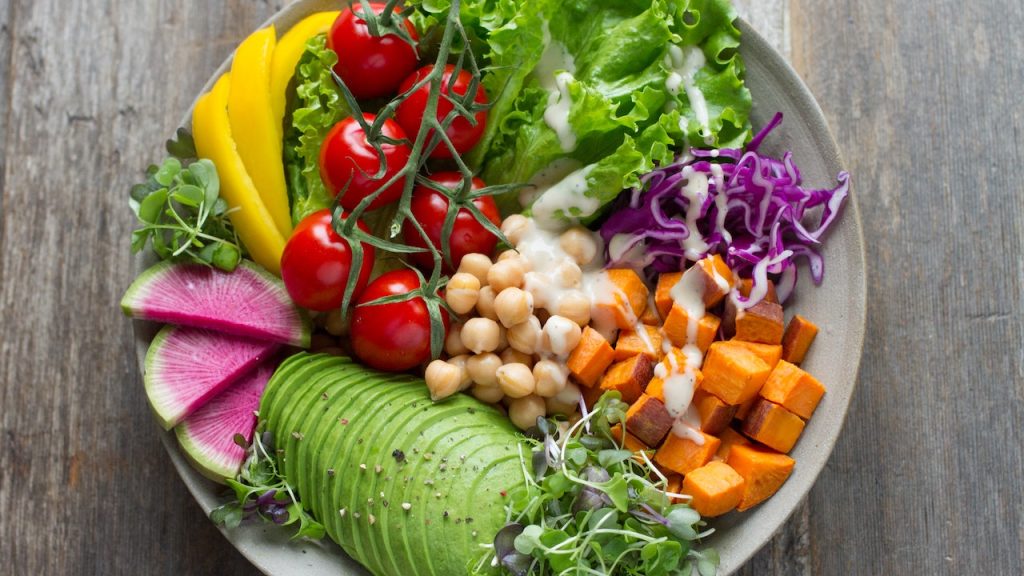 A plate of mixed colourful salads beautifully presented.