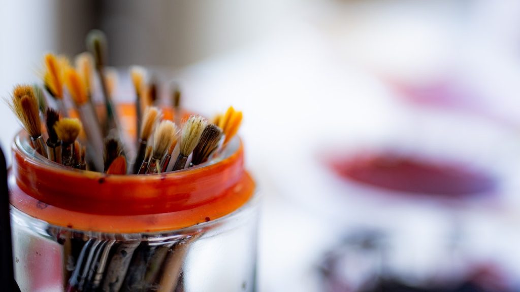 A jar of paintbrushes.