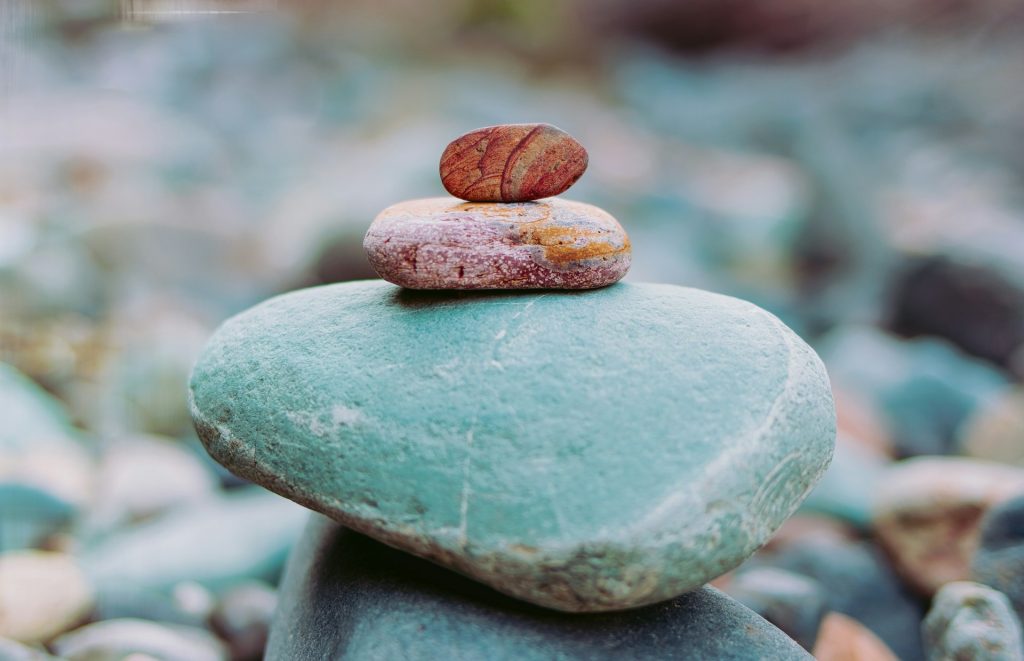 A series of pebbles being balanced one on top of another.