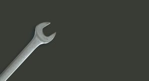 A spanner on a worktop.