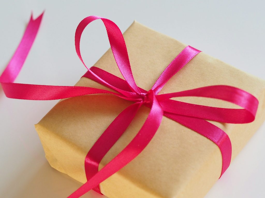 A present tied with ribbon in a bow.