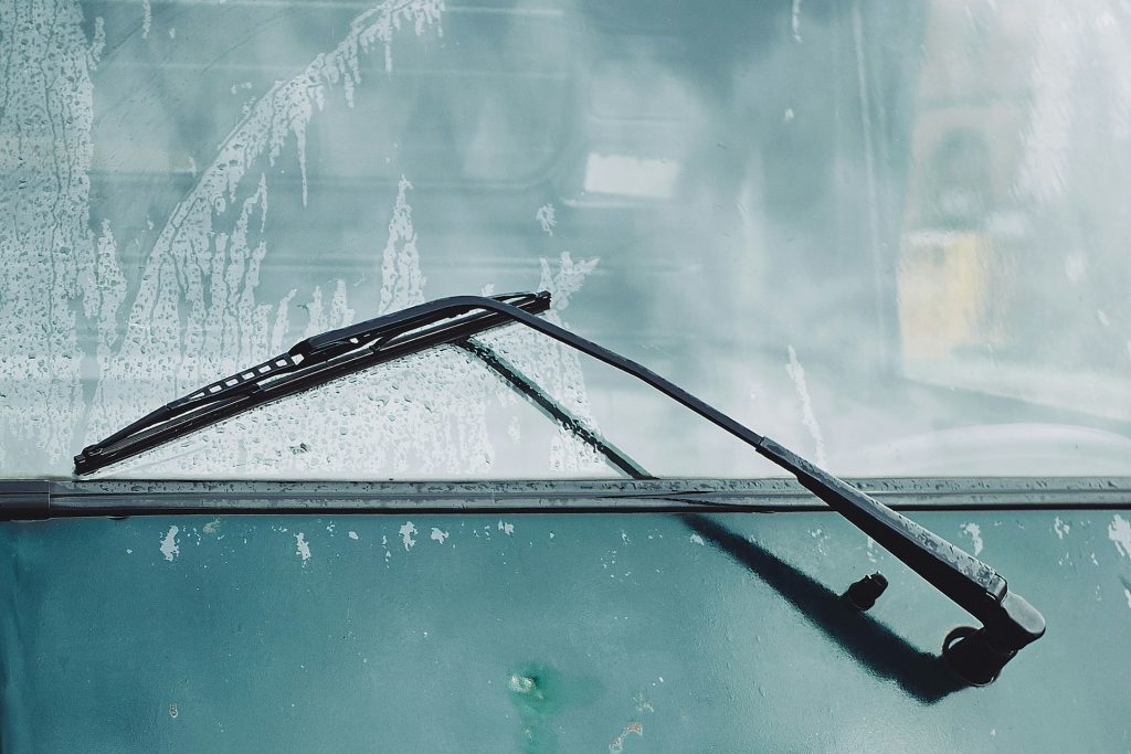 A windscreen wiper on a van in the rain.