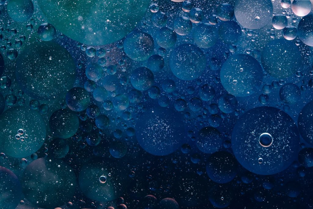 An abstract of blue bubbles of various sizes and depths.