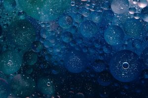An abstract of blue bubbles of various sizes and depths.