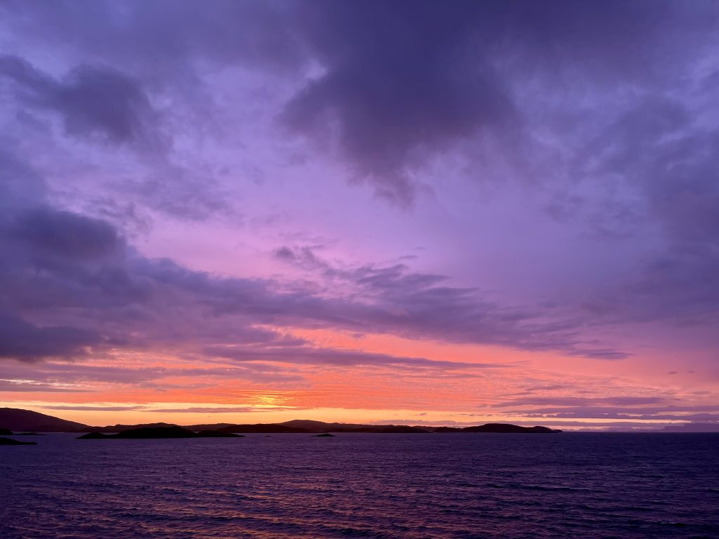 The sun rising over the mountains of Harris.