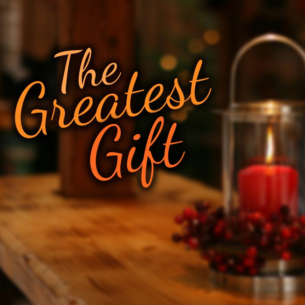 The Greatest Gift CD cover. A Christmas candle sits on a wooden shelf with the song title.
