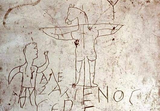The Alexamenos graffito. An inscription with a picture of a donkey-headed man on a cross with the words 'Alexamenos worships his god'.