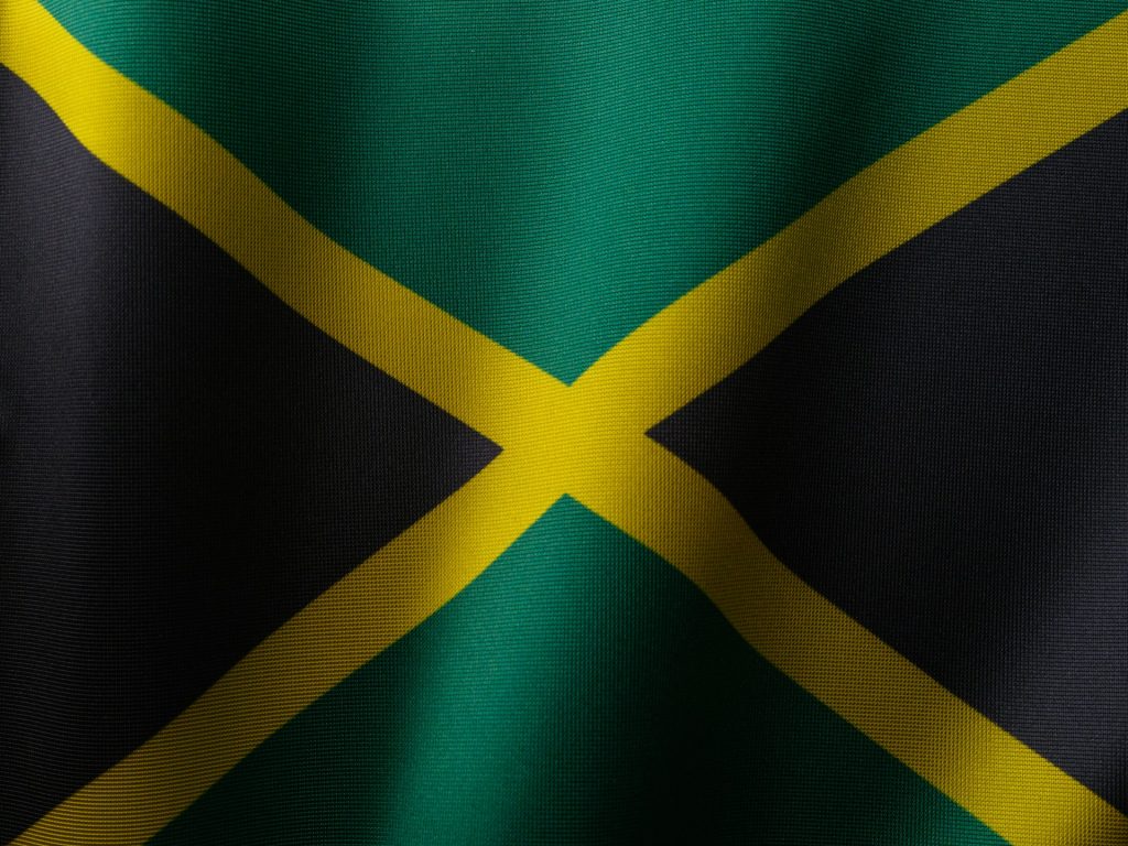 The Jamaica flag - a yellow cross on a green and black background.