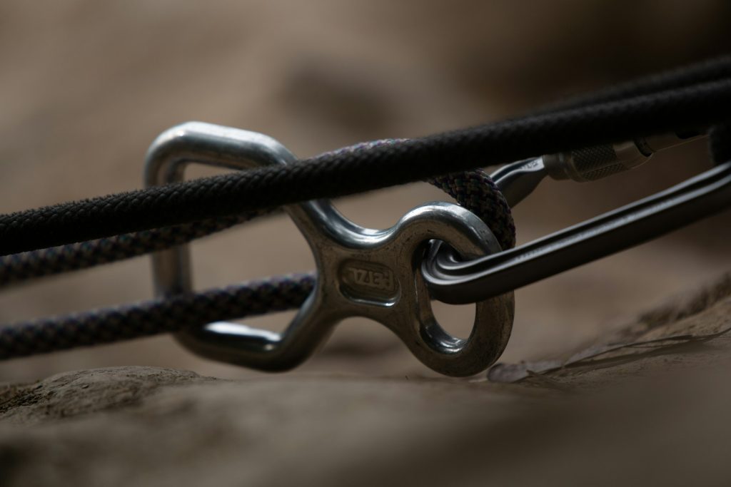 Reins A rope or rein buckle threaded and hooked onto a restraining rope.