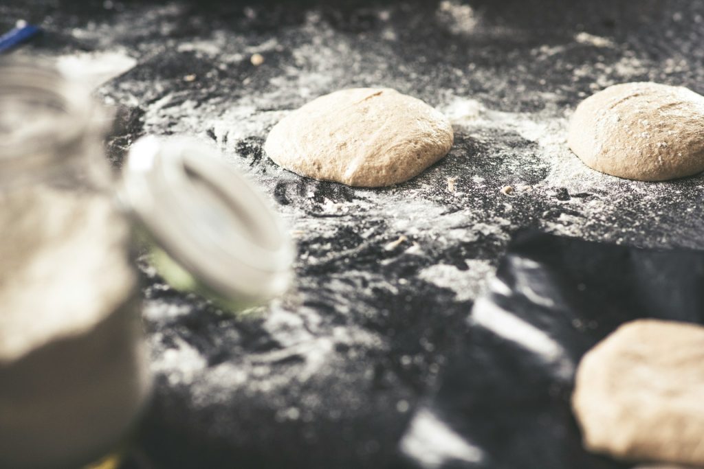 Bread dough on a floured surface ready to begin its rise.